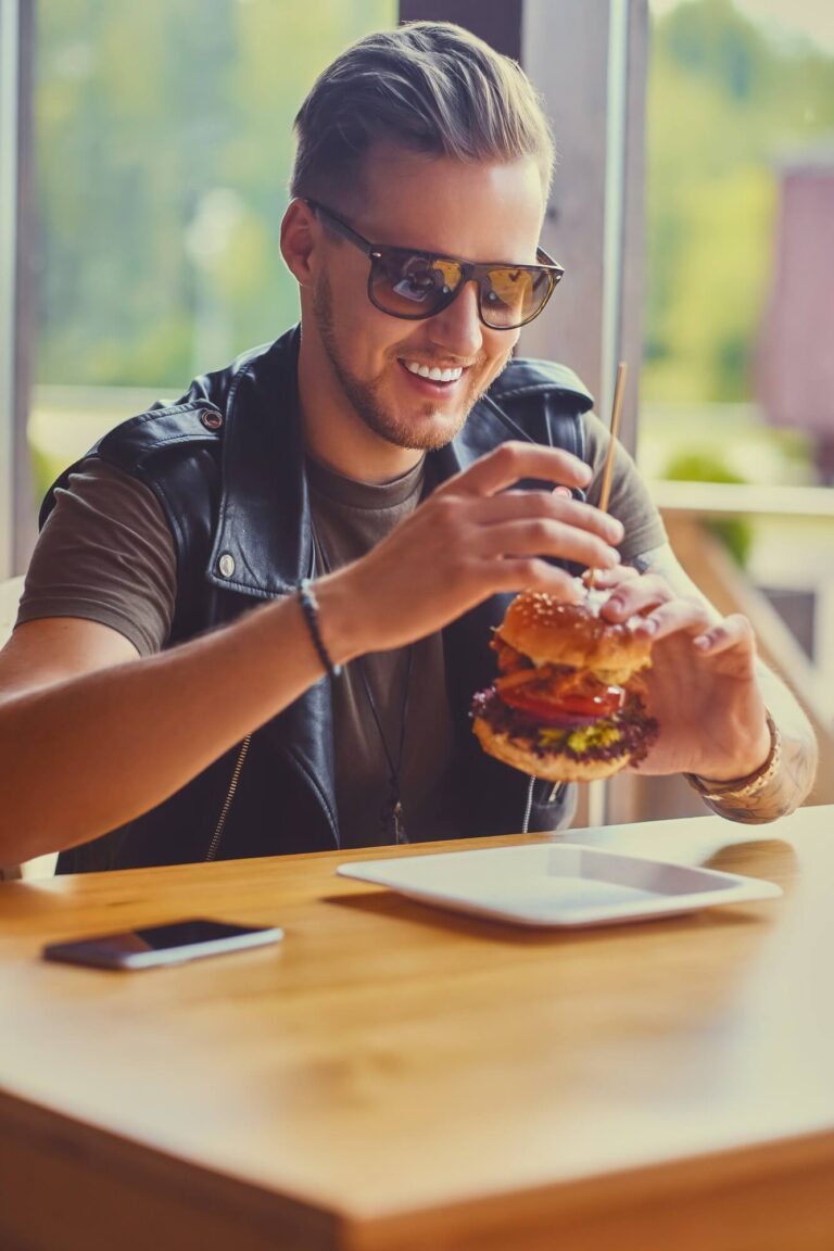 A man eating a vegan burger .jpg